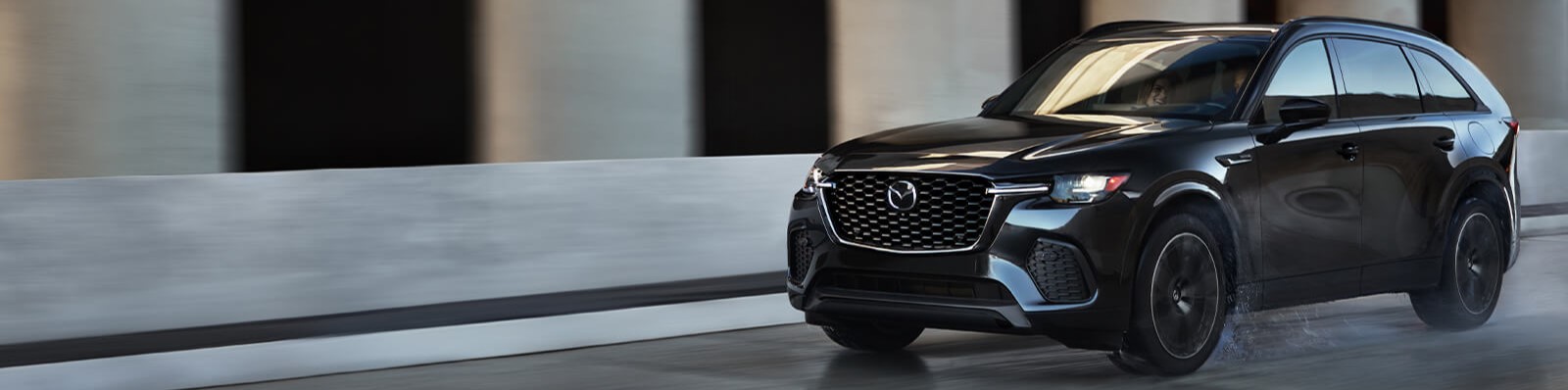 Mazda CX70 driving down road