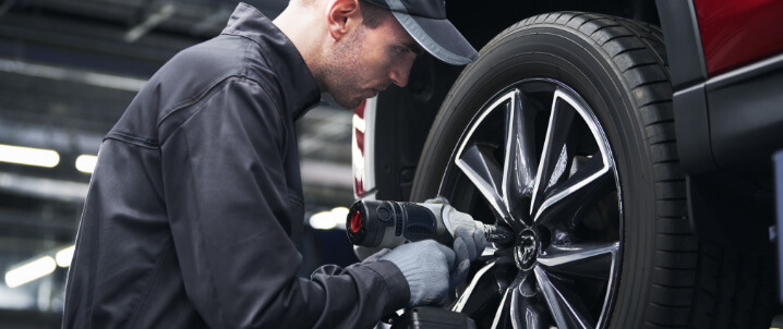 Technician working on tire